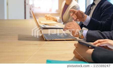 A group of multinational business people having a meeting A group of multinational business people having a meeting 115389247