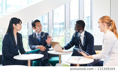 Group of multinational business people talking in a lobby Group of multinational business people talking in a lobby 115389264