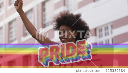 Image of rainbow flag and pride over african amrican female protester with banner 115389384