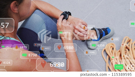 Image of media icons over caucasian woman with smartwatch on climbing wall 115389595