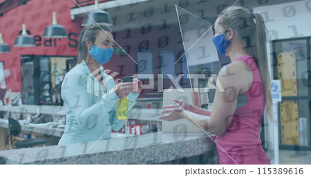 Image of binary coding over caucasian female worker with face mask disinfecting hands Image of binary coding over caucasian female worker with face mask disinfecting hands 115389616