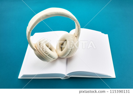 Audio book concept , white book with headphones 115390131