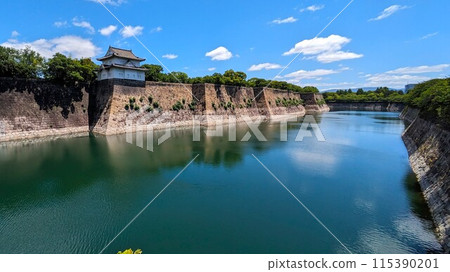 The sixth tower of the southern outer moat of Osaka Castle, filled with water and reflecting the blue sky The sixth tower of the southern outer moat of Osaka Castle, filled with water and reflecting the blue sky 115390201