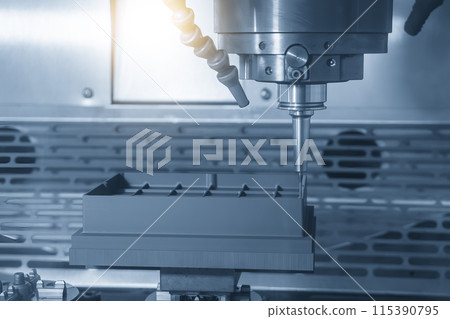 The CNC milling machine cutting the graphite electrode parts. 115390795