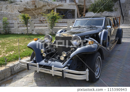 Front view of a black retro premium car from the 30s of the 20th century 115390943