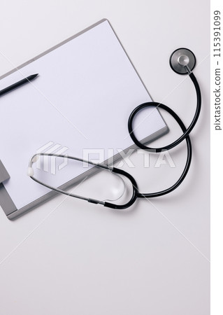 a stethoscope on a clipboard 115391099
