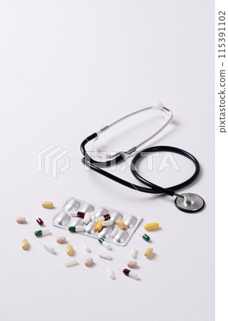 stethoscope and scattered pills stethoscope and scattered pills 115391102