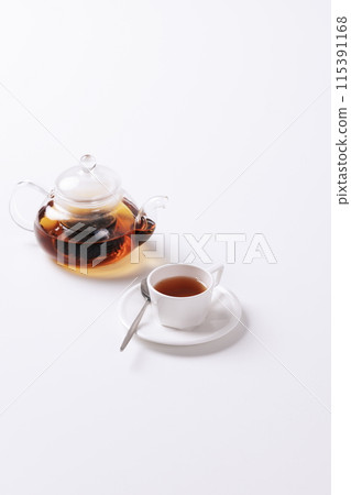 a warm glass teapot and teacup set 115391168