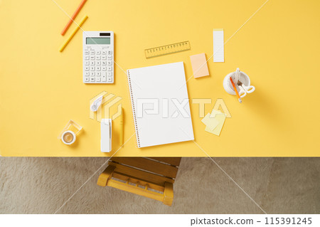 notebooks and office supplies on the yellow desk notebooks and office supplies on the yellow desk 115391245