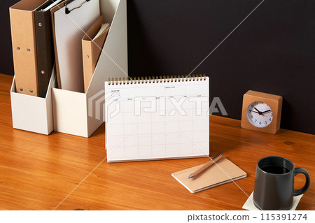 the bookshelves and tabletop achievements on the wooden desk 115391274