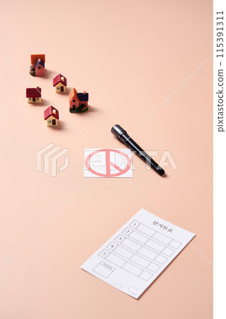 Miniature houses, election stamps and ballots Miniature houses, election stamps and ballots 115391311