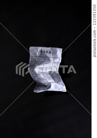 a crumpled of a ballot 115391350