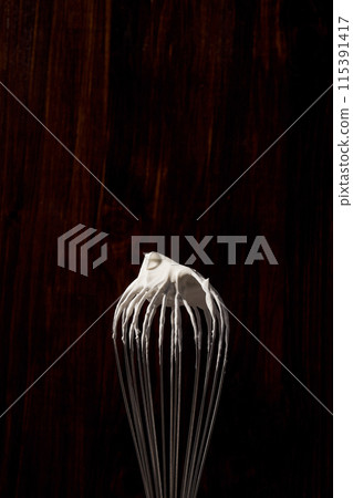 whipped cream on the whisk 115391417