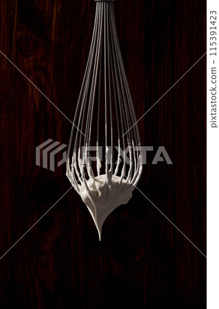 whipped cream on the whisk 115391423