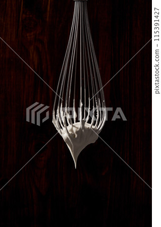 whipped cream on the whisk 115391427