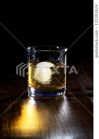 a glass of whisky with ice a glass of whisky with ice 115391624