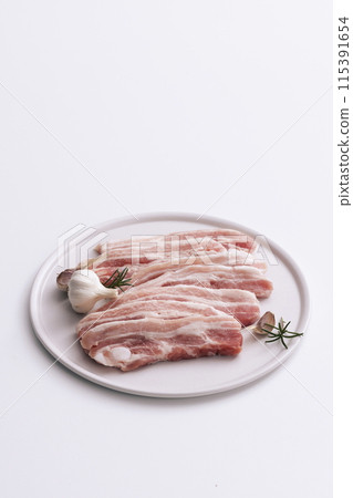 fresh pork belly piled on wooden chopping boards fresh pork belly piled on wooden chopping boards 115391654