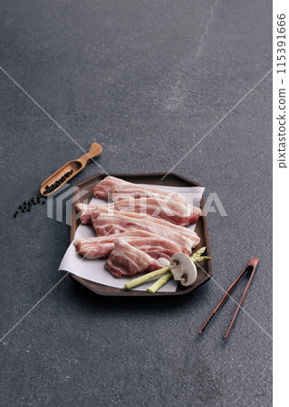 fresh pork belly piled up on a white tray fresh pork belly piled up on a white tray 115391666