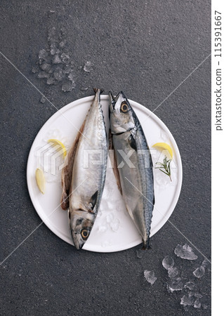 Two fresh mackerel on a tray Two fresh mackerel on a tray 115391667