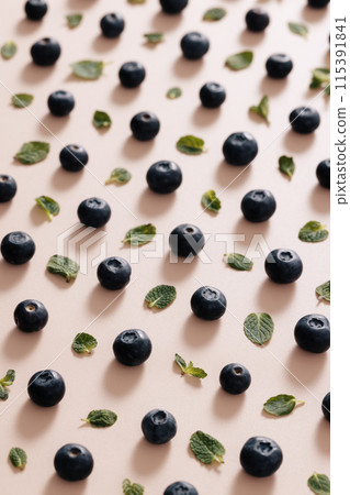 regular blueberries and green leaves 115391841