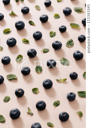 regular blueberries and green leaves 115391845