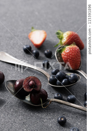berries filled with spoons berries filled with spoons 115391896