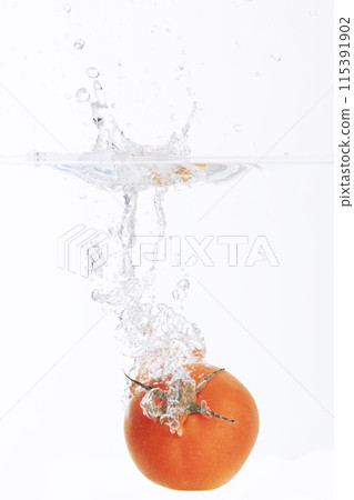 Red Tomatoes Falling Underwater 115391902