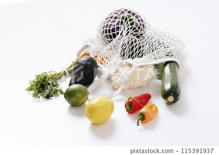 various kinds of fruits and vegetables that come out of the net bag 115391937
