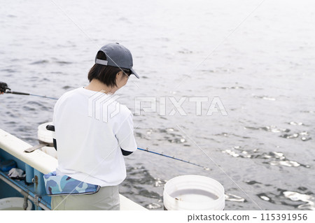 Cute woman enjoying fishing 115391956