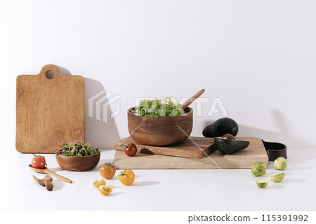 green vegetables filled with winemock chopping boards and wood bowls green vegetables filled with winemock chopping boards and wood bowls 115391992