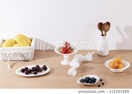 Table setting of fresh vegetables and fruits on a wooden table Table setting of fresh vegetables and fruits on a wooden table 115391999