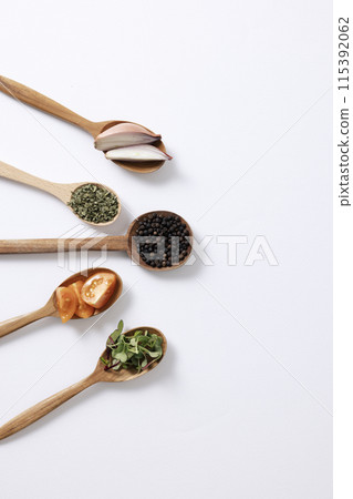 arrangement of tree cutlery with vegetables and spices arrangement of tree cutlery with vegetables and spices 115392062