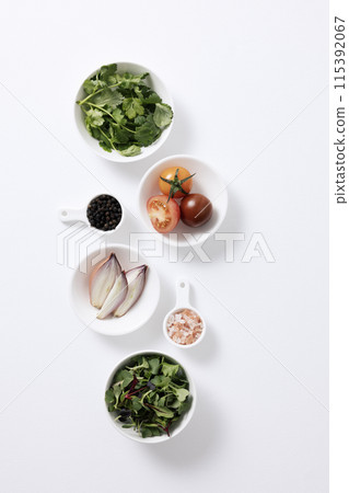 the composition of salad ingredients on a white plate the composition of salad ingredients on a white plate 115392067