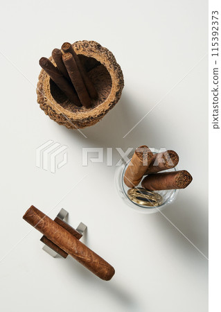 a cigar and match in a woodball a cigar and match in a woodball 115392373