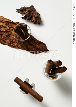 matches and cigars in a glass cup 115392378