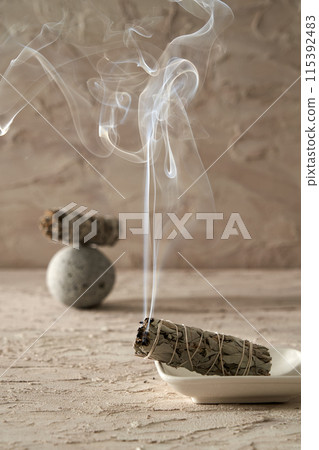 Smouldering stick with smoke Smouldering stick with smoke 115392483