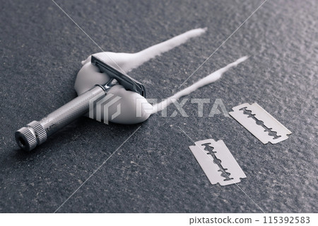 Shaving foam on the floor with a razor Shaving foam on the floor with a razor 115392583