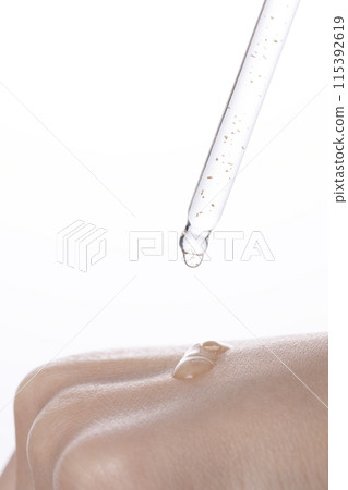 a drop of moist ampoule on the back of the hand 115392619