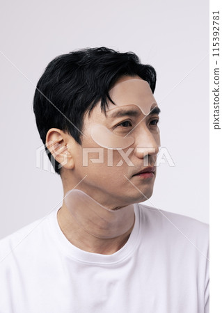 a middle aged man with a cosmetic patch on his face a middle aged man with a cosmetic patch on his face 115392781