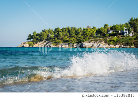 Sea waves breaking on the shore 115392815