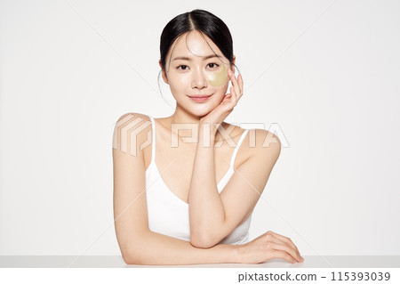 Asian Woman Poses With Eyepatch on Her Face Asian Woman Poses With Eyepatch on Her Face 115393039