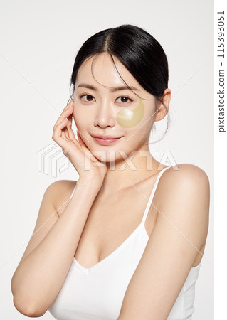 Asian Woman Poses With Eyepatch on Her Face Asian Woman Poses With Eyepatch on Her Face 115393051