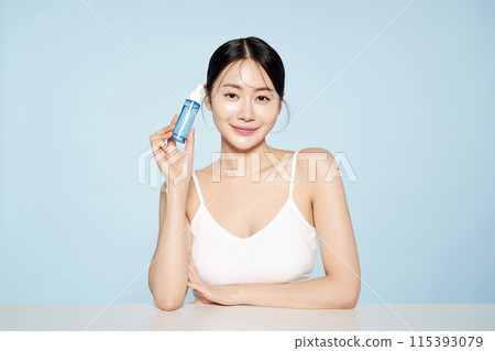 Asian woman posing with eye patches on both cheeks Asian woman posing with eye patches on both cheeks 115393079
