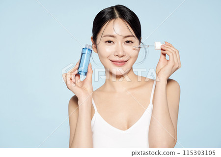 Asian woman posing with eye patches on both cheeks 115393105