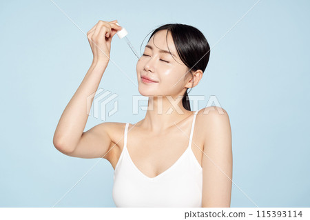 Asian Woman Drops Ampoule On Her Face With Spoid 115393114