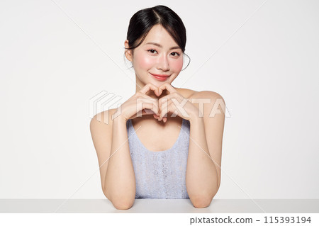 Asian Woman Makes Finger Hearts Asian Woman Makes Finger Hearts 115393194