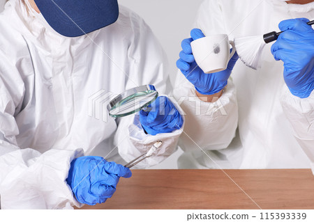 Researchers from the CSI Scientific Investigation Unit identifying evidence and collecting fingerprints at crime and incident sites Researchers from the CSI Scientific Investigation Unit identifying evidence and collecting fingerprints at crime and incident sites 115393339