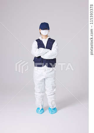 CSI female researcher standing in protective clothing and security vests CSI female researcher standing in protective clothing and security vests 115393378