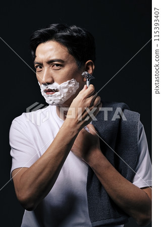 a middle aged man about to start shaving a middle aged man about to start shaving 115393407