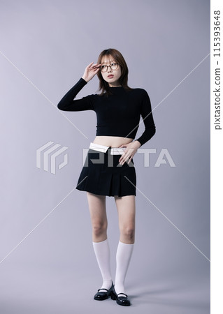 A 20s Korean Woman Wearing Geek Look and Glasses 115393648